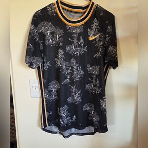 Nike Black and White Graphic Tee with Orange Accents
